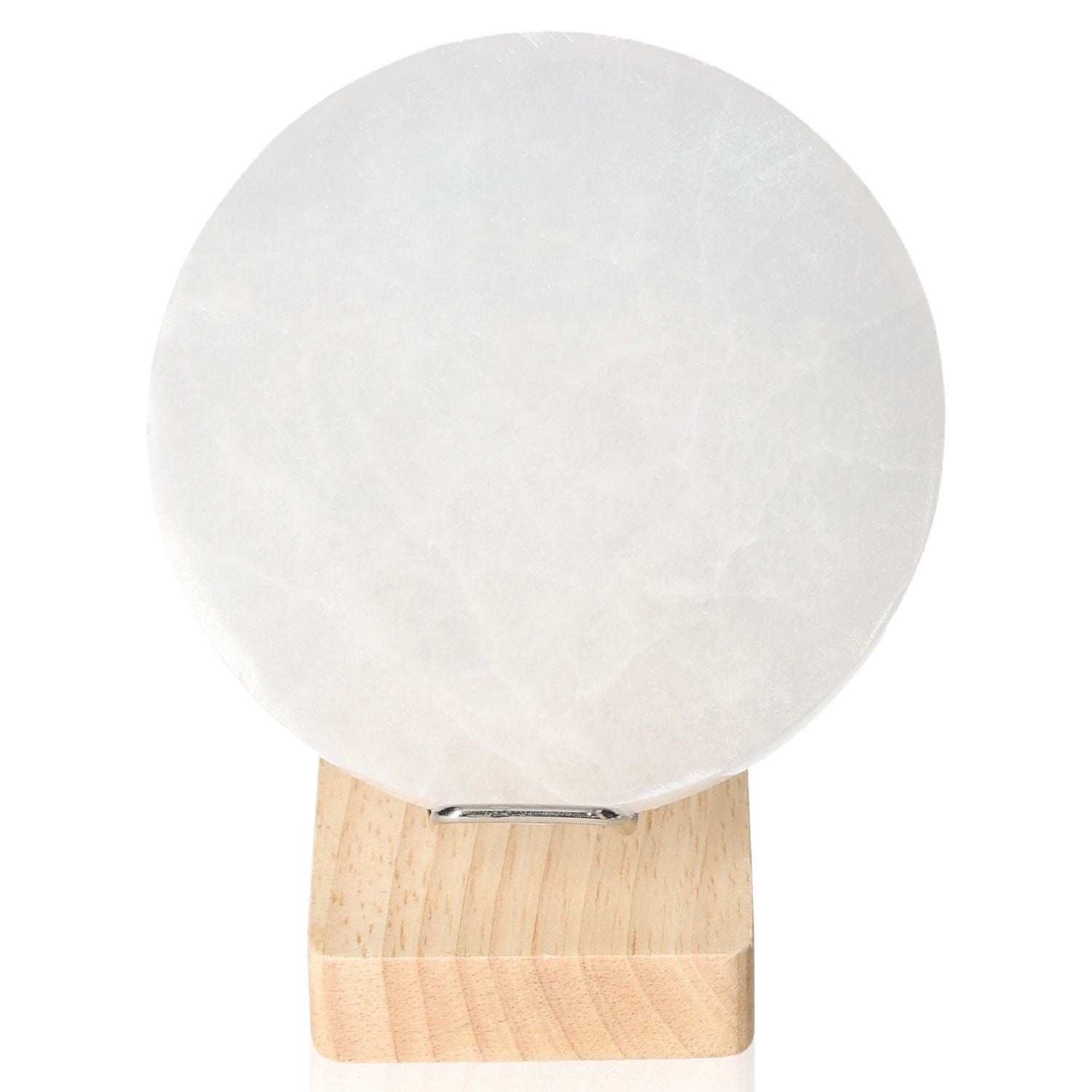 Selenite Disk 12cm by Sylvia Crystals on wooden stand, ideal for spiritual growth and mindful living.