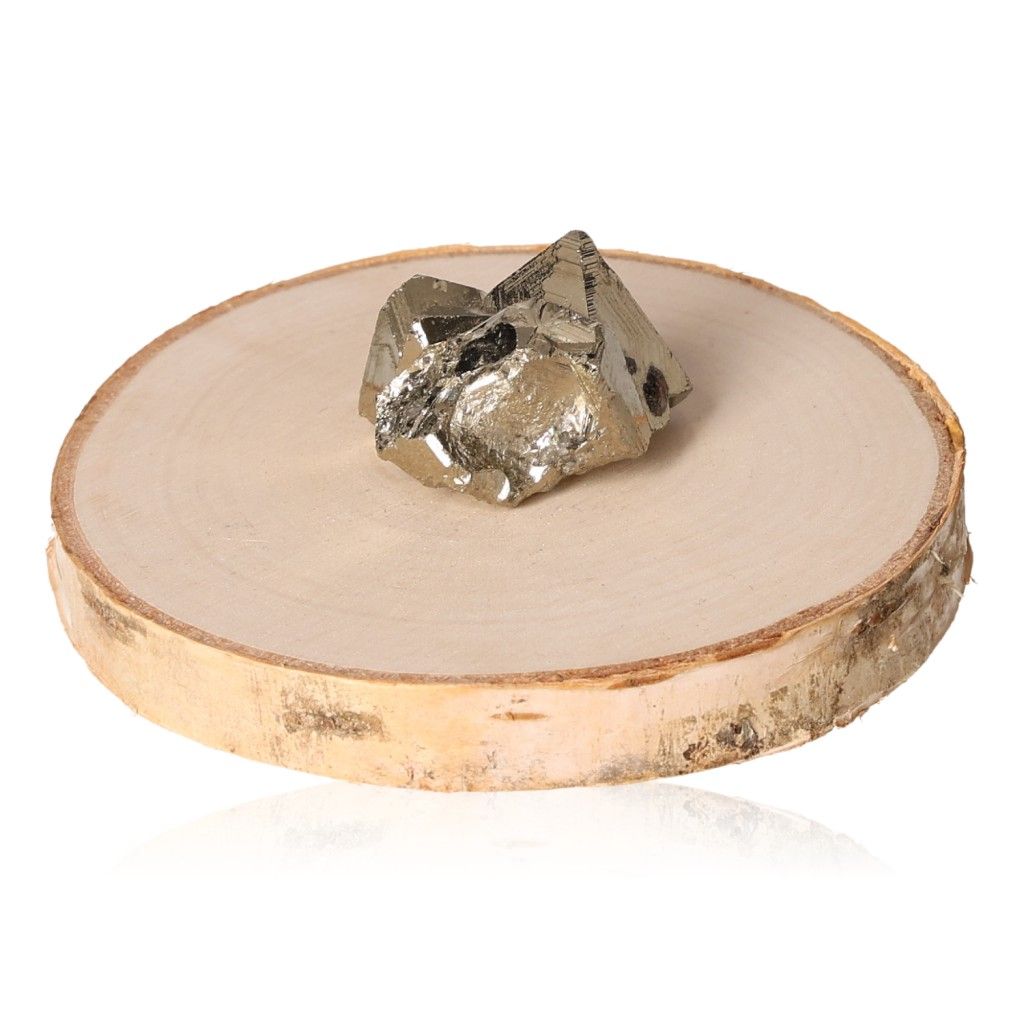 Pyrite druzy stone on wooden slab, enhances independence, inspires ideas and action, promotes courage and goal achievement.