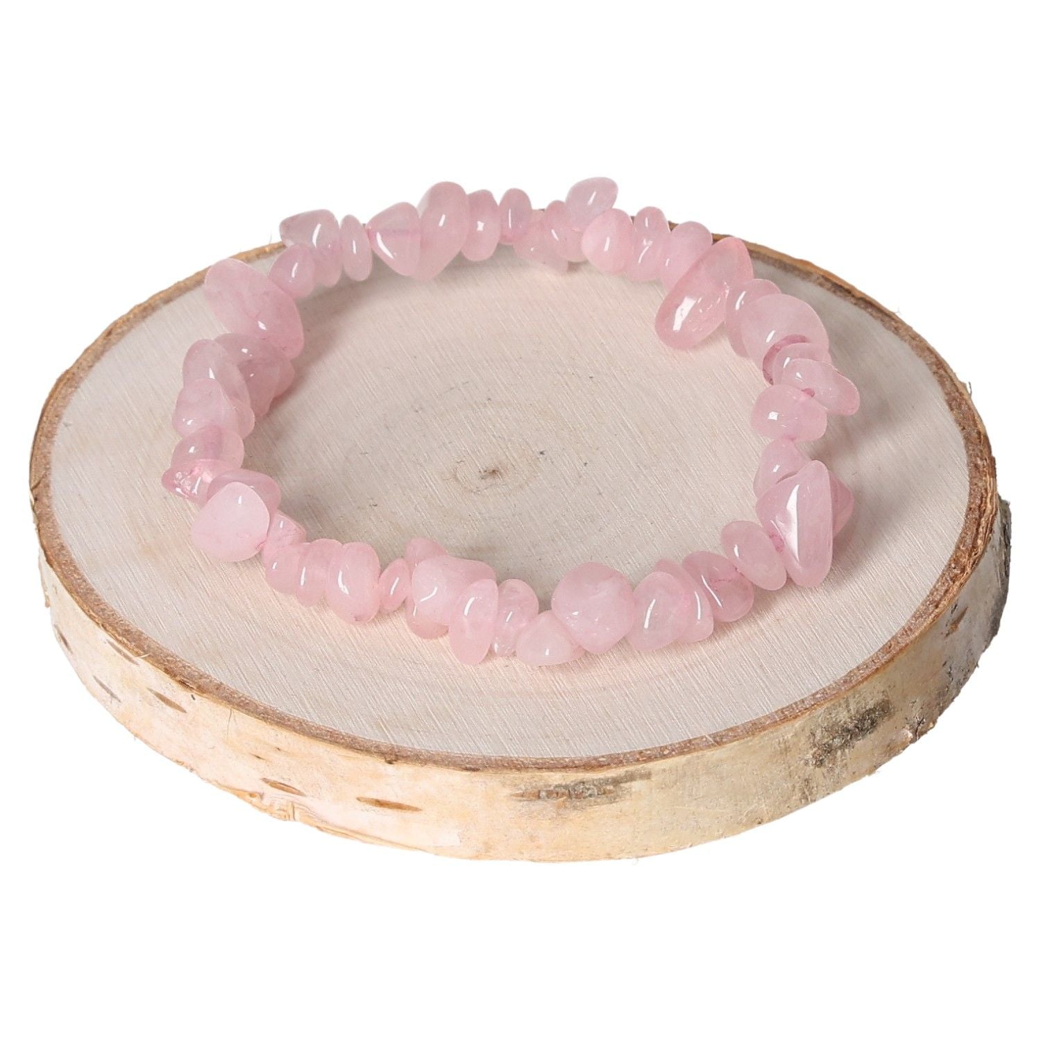 Rose quartz bracelet chips displayed on a wooden stand