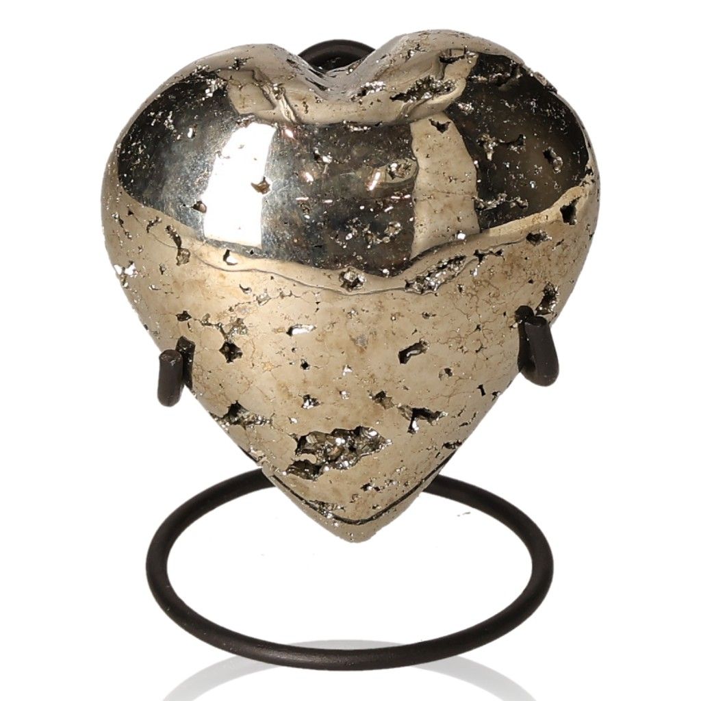 Pyrite heart stone on stand, promoting independence and courage for goal achievement.