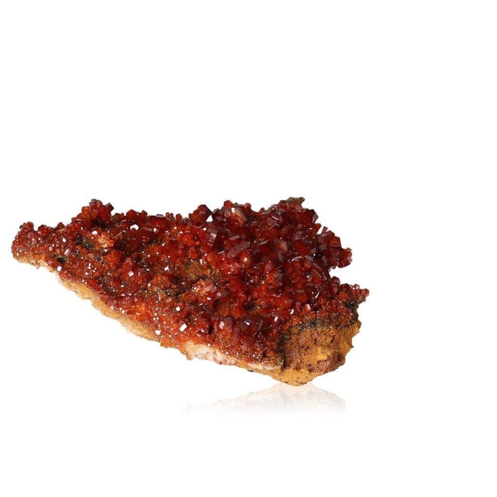 Vanadinite Druze with vibrant reddish-brown hexagonal crystals on a glassy surface, enhancing focus and determination.