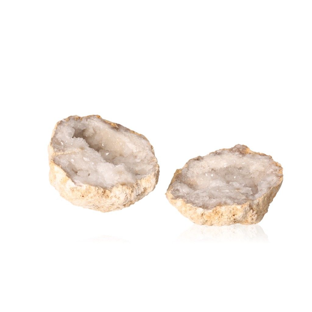 Milky quartz geode with rugged outer shell and sparkling white crystals, known for purifying energy and enhancing tranquility.