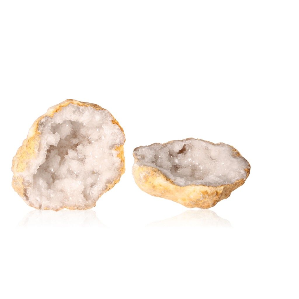 Milky quartz geode with cloudy white crystals and rugged outer shell, known for purifying energy and promoting focus.