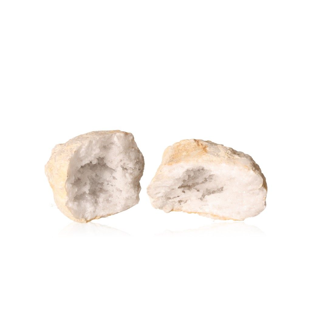 Milky quartz geode with rugged exterior and sparkling white crystals, boosting tranquility and clarity in spaces.