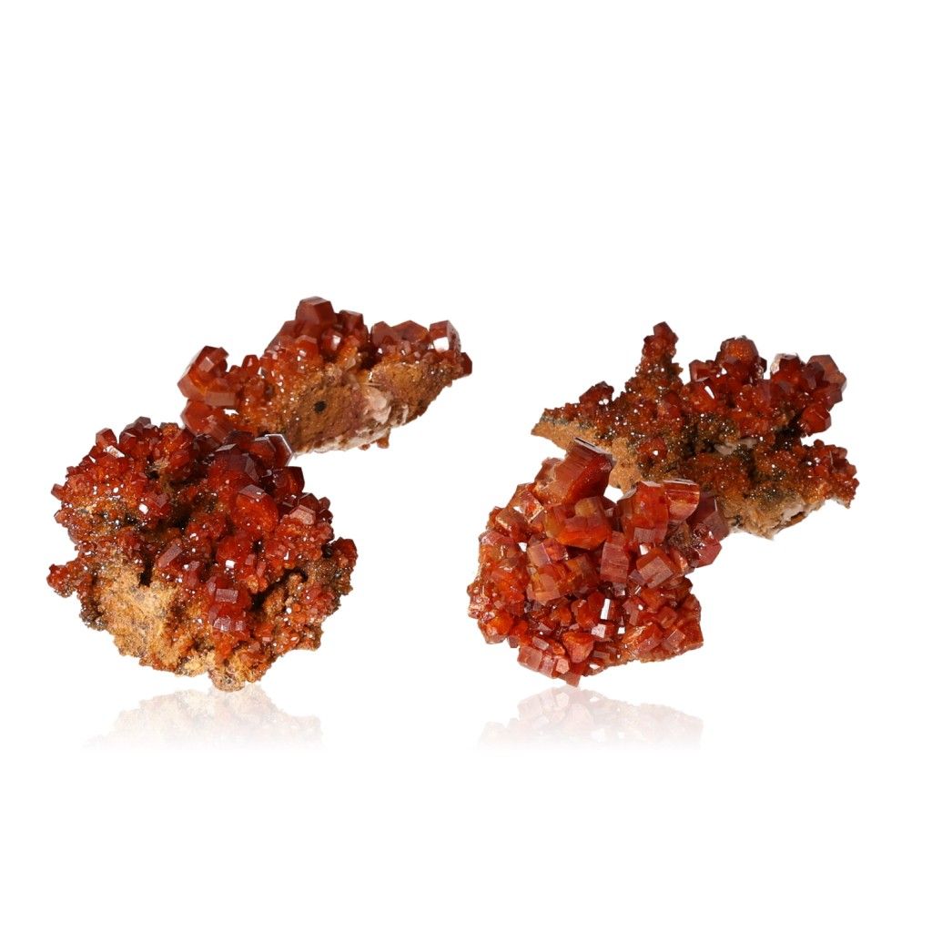 Vanadinite small druzes with vibrant reddish-orange hexagonal crystals on a glassy surface, enhancing focus and personal transformation.