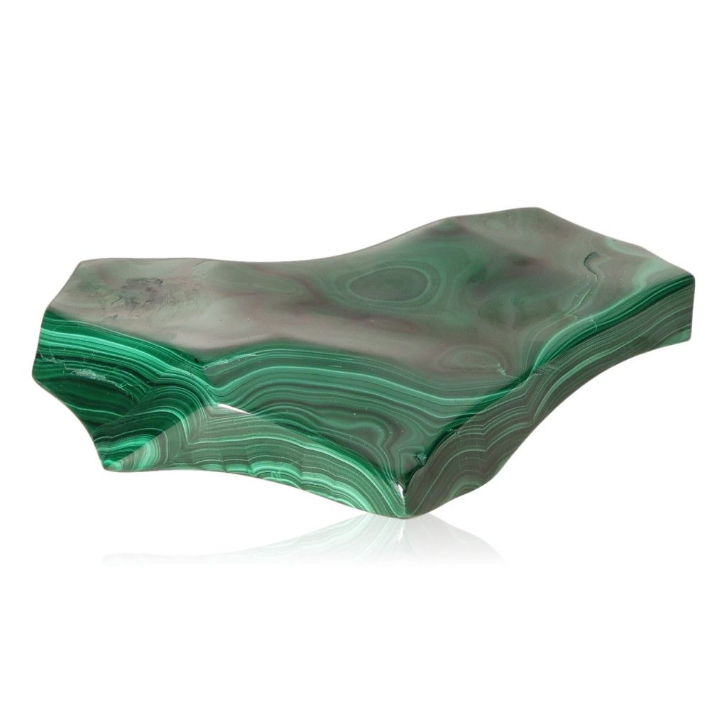 Polished green malachite stone with natural swirling patterns, symbolizing courage and inner harmony.