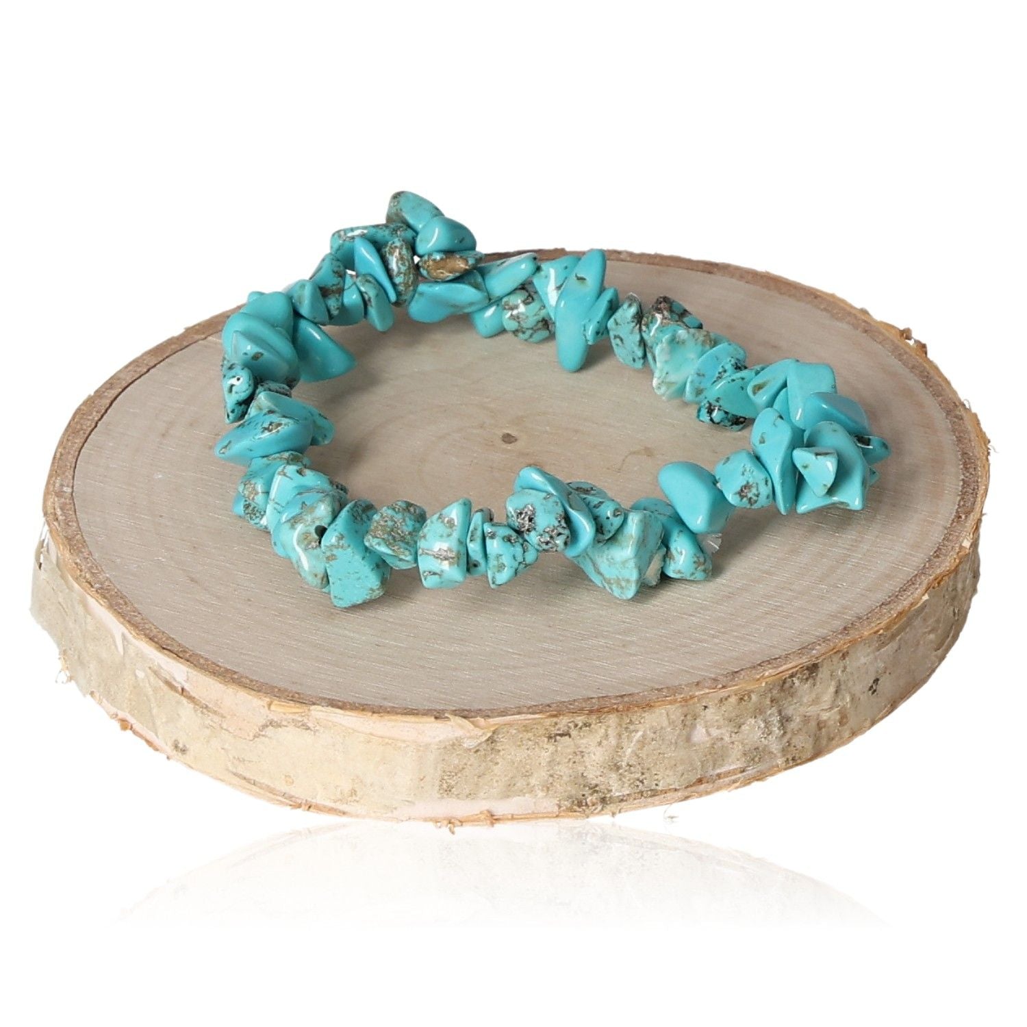 Turquenite bracelet chips displayed on a wooden surface, showcasing vibrant blue-green hues and natural stone textures.