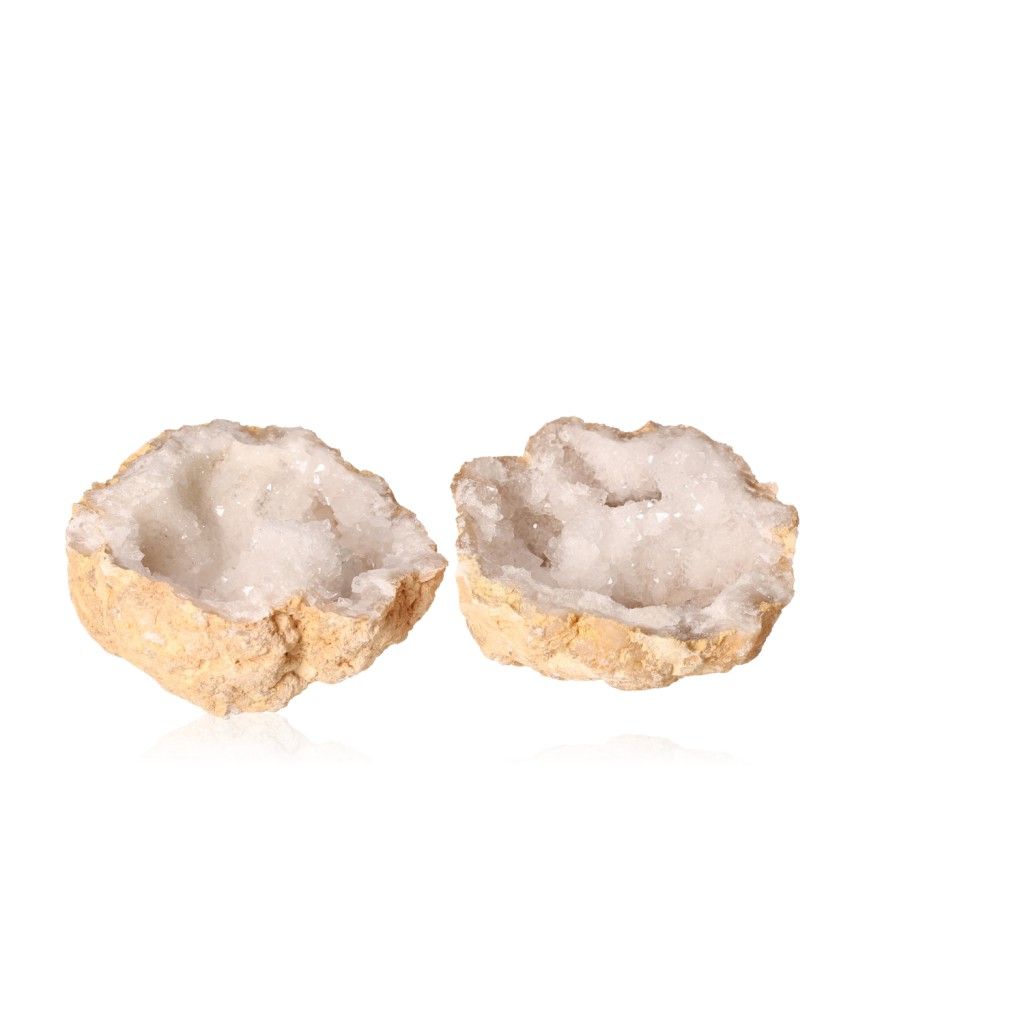 Milky quartz geode split open to reveal sparkling cloudy white crystals, known for purifying energy and enhancing clarity.