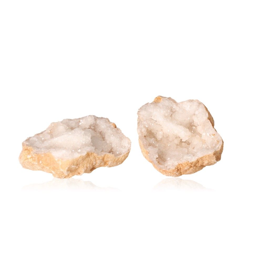 Milky quartz geode split open showing sparkling white crystals for energy purification and clarity enhancement.