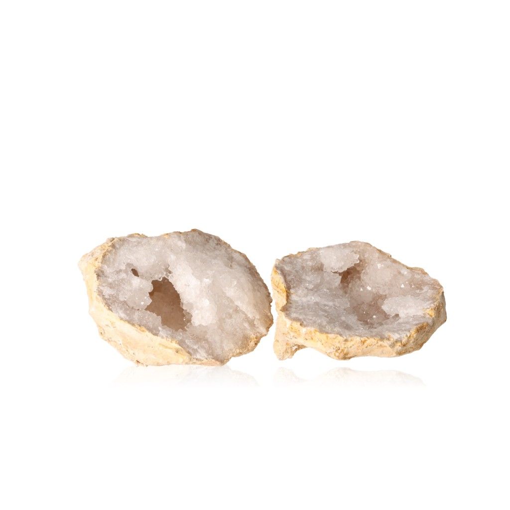 Quartz geodes with milky crystals and earthy shell, known for amplifying energy and promoting tranquility and focus.