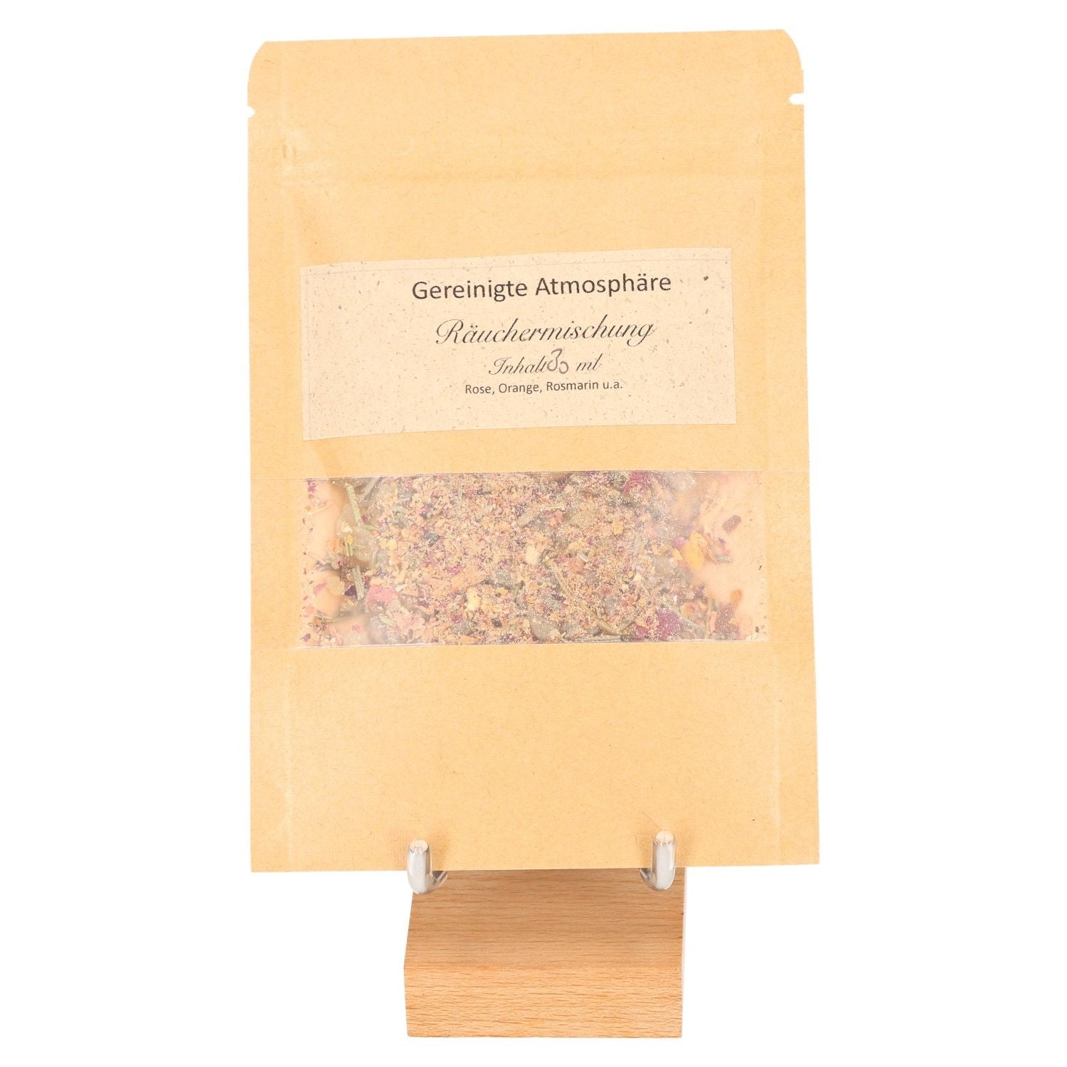 Brown packaging of Cleansed Atmosphere incense blend with rosemary, orange, and rose, displayed on a wooden stand.