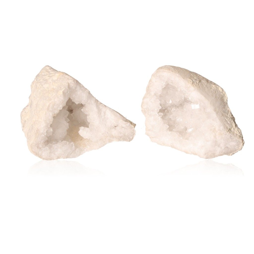 Milky quartz geode pair showing rugged outer shell and sparkling white crystals, ideal for energy balance and focus enhancement.