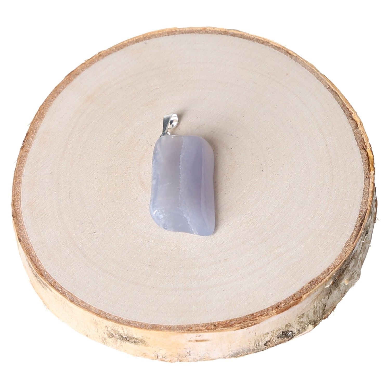 Chalcedony AA tumbled pendant on wooden slice background