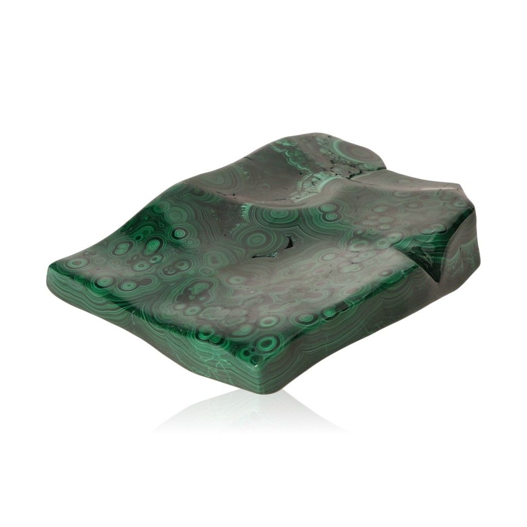 Polished malachite stone with rich green swirls, known for soothing energy and fostering courage and optimism.