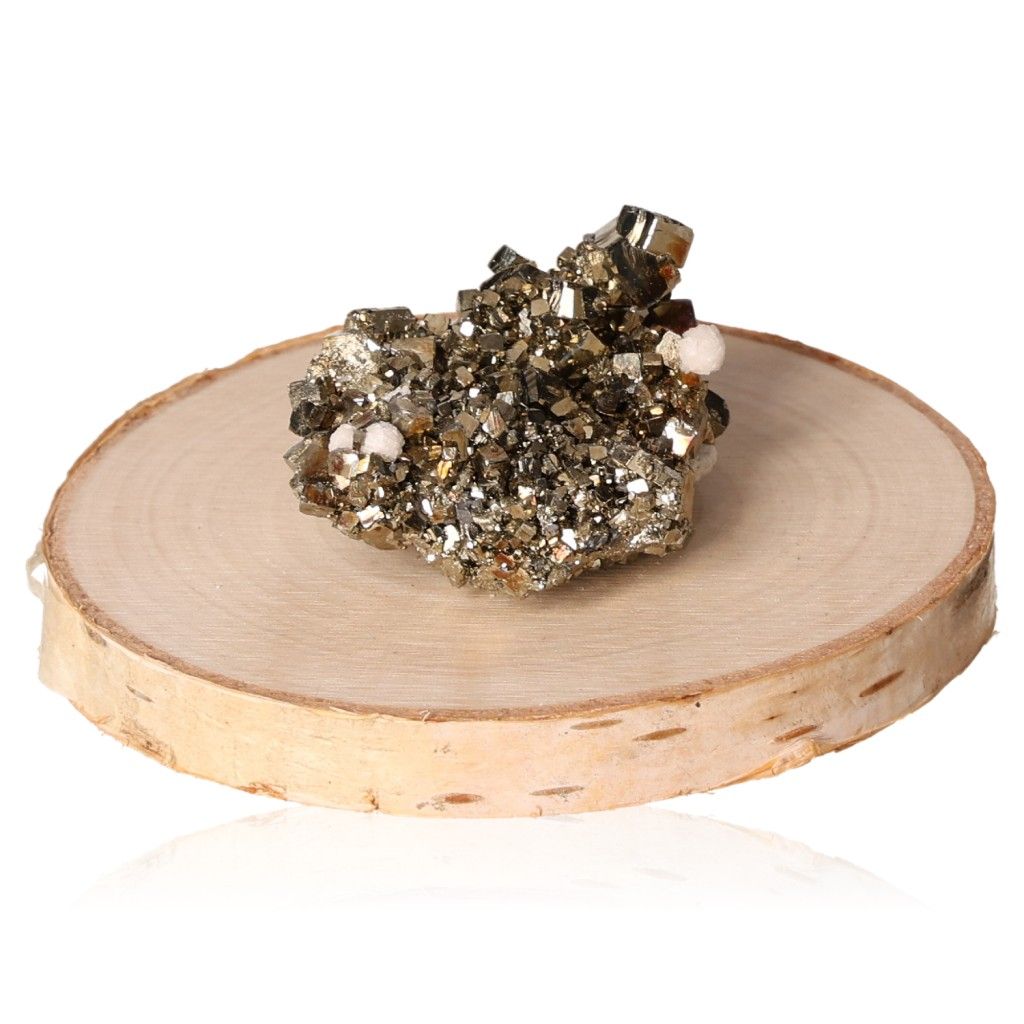 Sparkling pyrite druze crystal on a wooden slice, promoting mental clarity and courage.