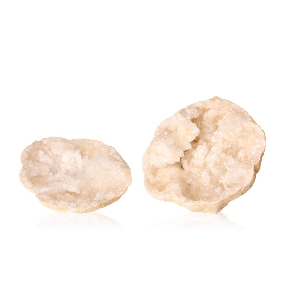 Milky quartz geodes with sparkling white crystals, known for purifying energy and enhancing tranquility.