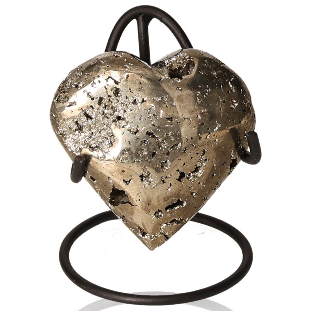 Heart-shaped pyrite stone on stand for independence and courage development.