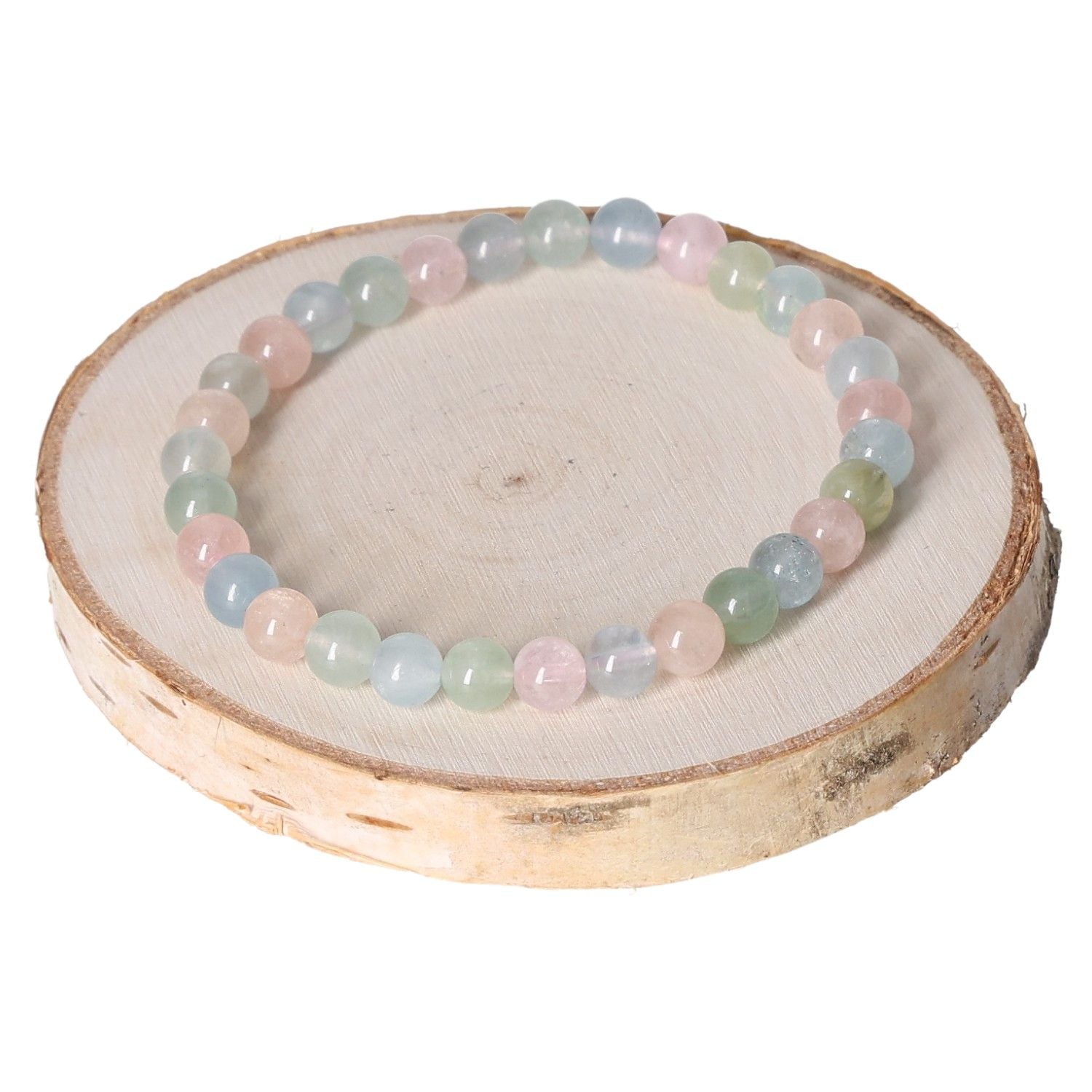 Morganite MIX Bracelet with 6mm beads, displayed on a wooden stand, showcasing pastel colors and natural beauty.