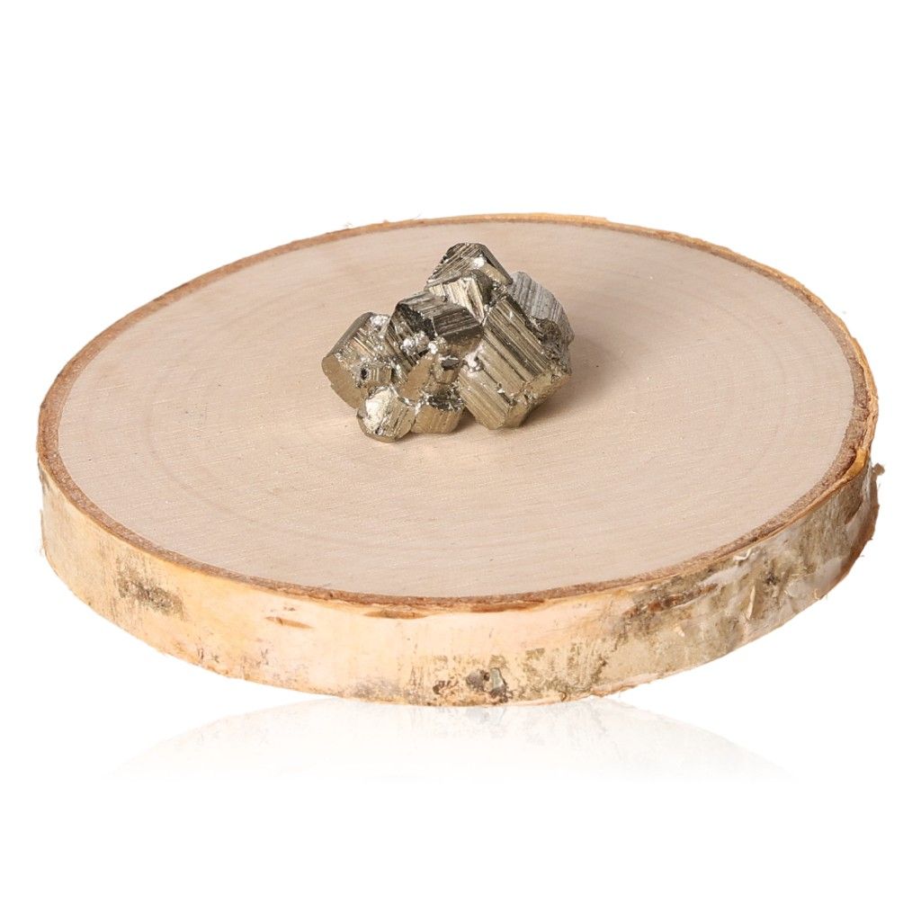 Pyrite druzy crystals displayed on a wooden slab, promoting independence and courage, ideal for inspiring action and achieving goals.