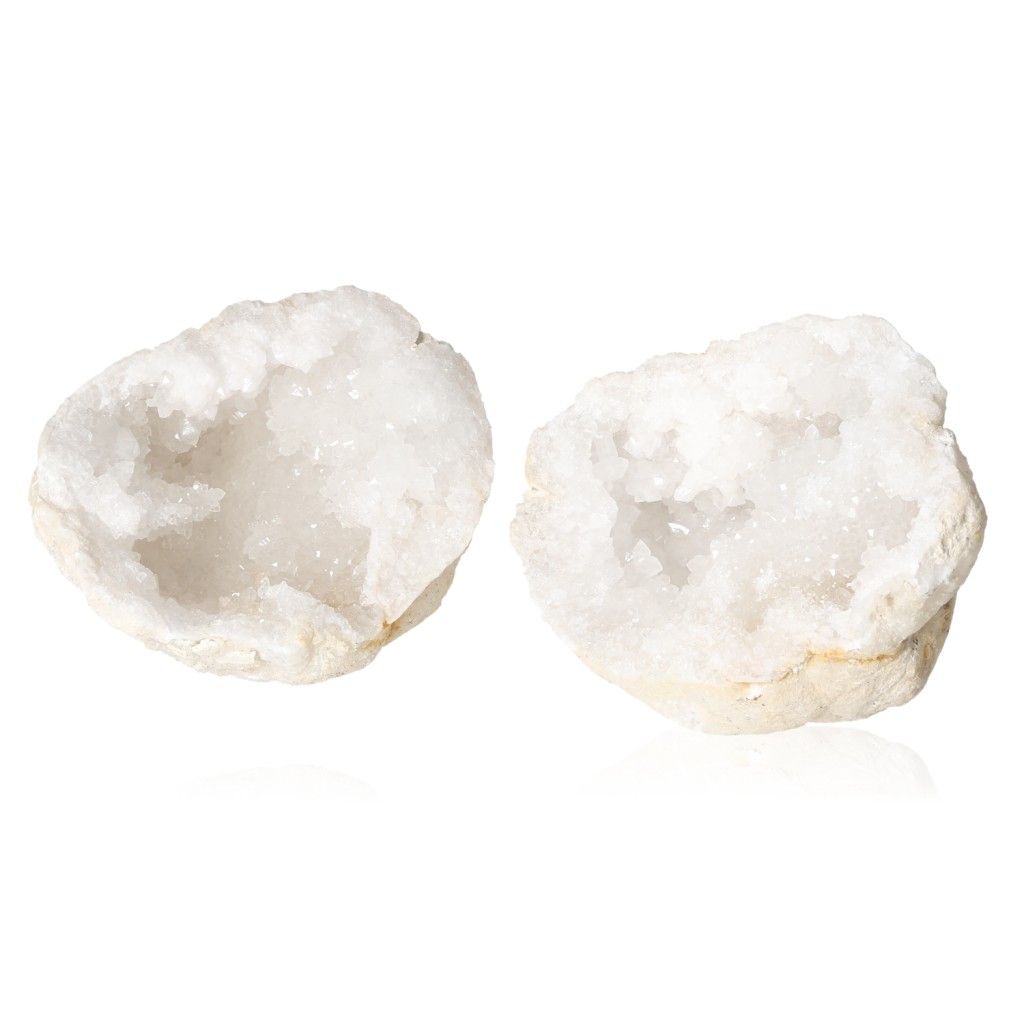 Milky quartz geode halves revealing sparkling, cloudy white crystals known for purifying energy and enhancing tranquility.