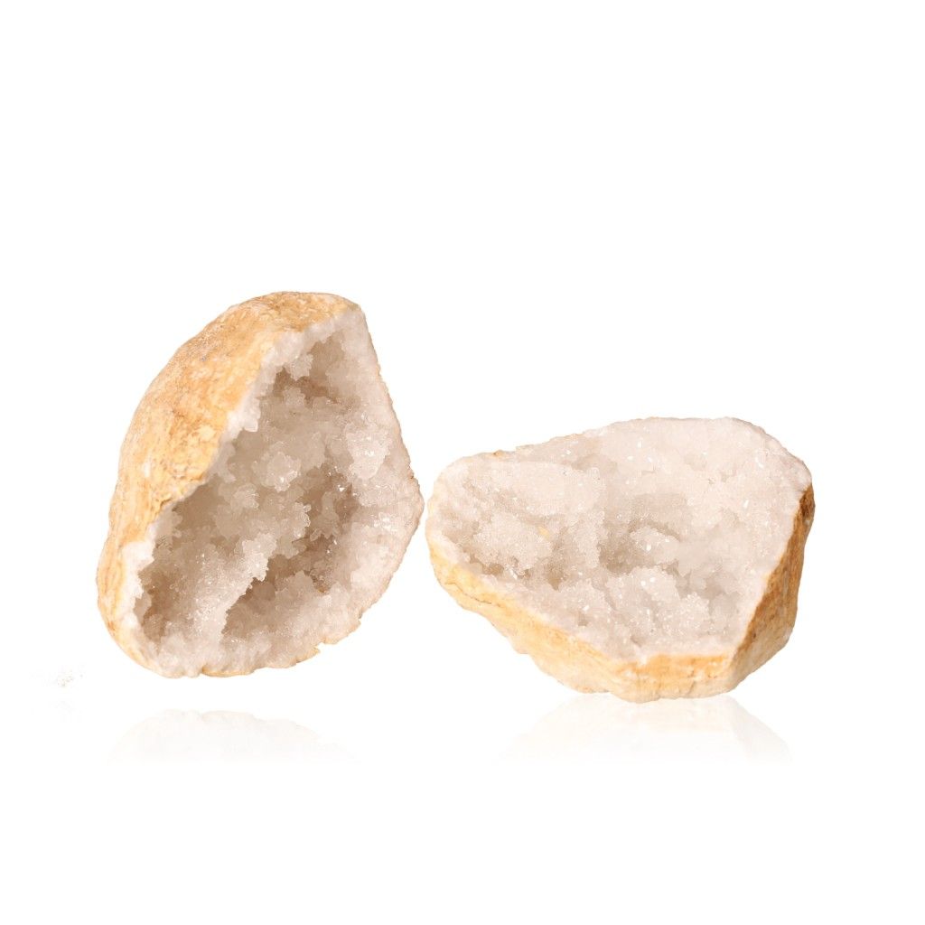 Milky quartz geode with earthy shell and sparkling white crystals, ideal for energy balance and promoting tranquility and clarity.