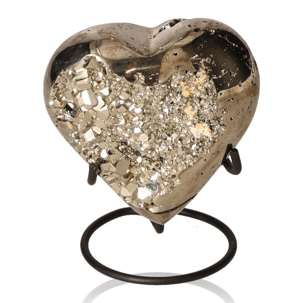 Pyrite heart sculpture on a stand, symbolizing inspiration, courage, and motivation for personal growth and initiative.