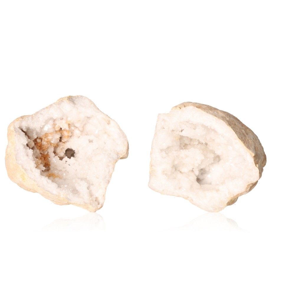 Milky quartz geodes with sparkling white crystals, known for amplifying energy and promoting tranquility, shown opened on a white background.