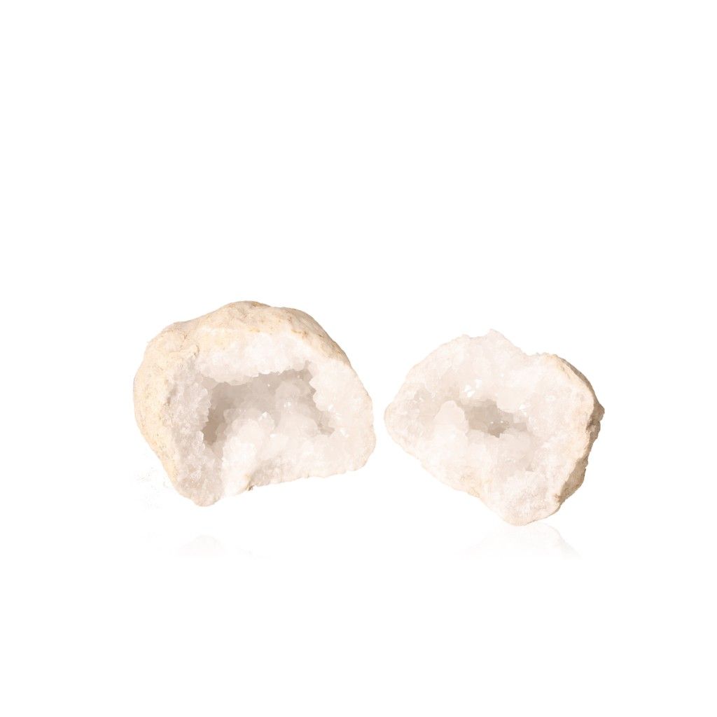 Milky quartz geodes with sparkling white crystals and rugged outer shell, known for purifying energy and enhancing tranquility.