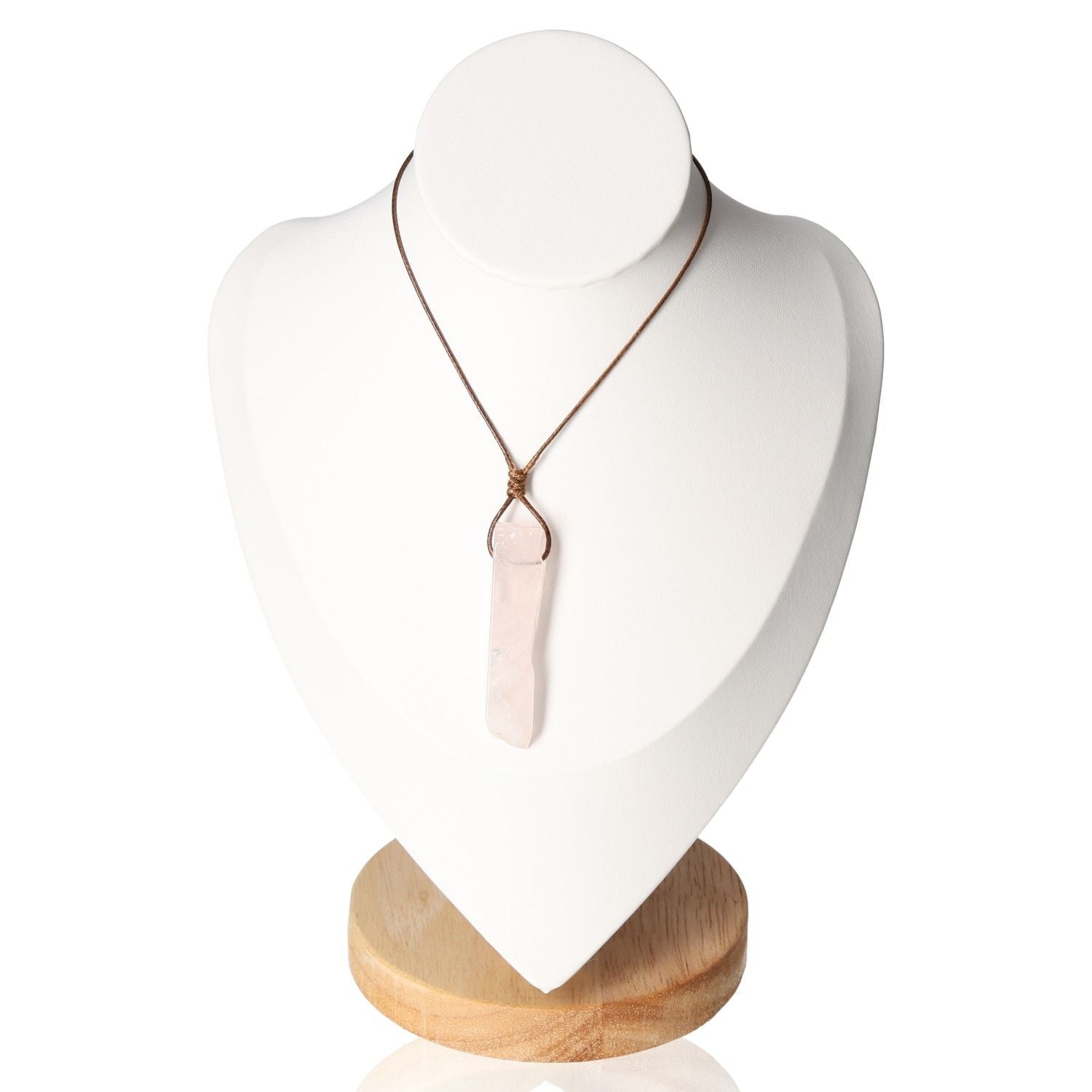 Boho necklace with rose quartz pendant on a display stand, showcasing a heart-opening gemstone for tranquility and love.