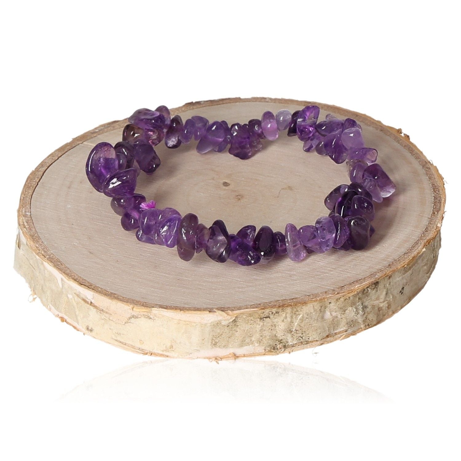 Amethyst bracelet chips on a wooden stand showcasing vibrant purple gemstones for elegant jewelry styling.