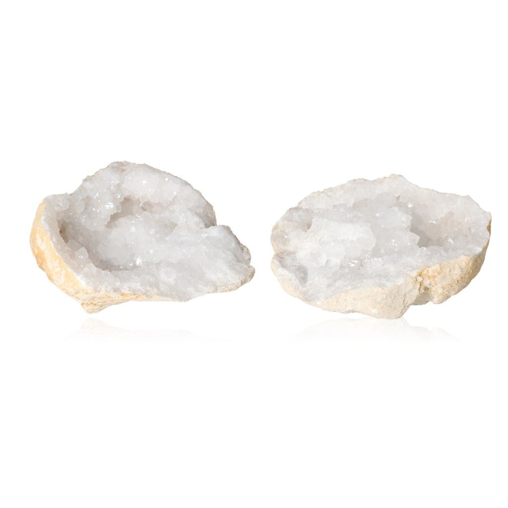 Milky quartz geode halves displaying sparkling, cloudy white crystals and rugged shell for energy purification and clarity enhancement.