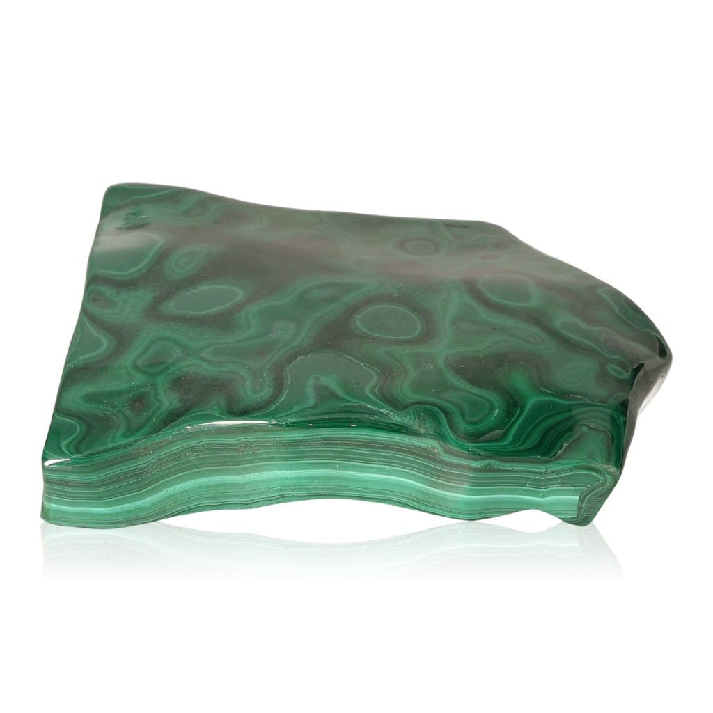 Polished green malachite stone with swirling patterns, known for its soothing and energizing properties.