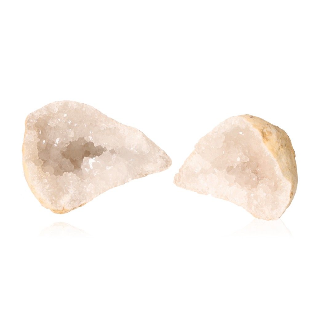 Milky quartz geode revealing cloudy white crystals, known for purifying energy and enhancing tranquility and clarity.