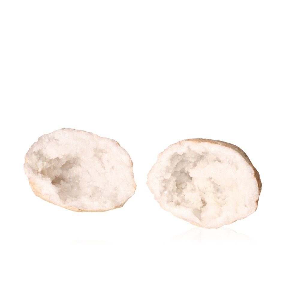 Milky quartz geode split open showcasing sparkling cloudy white crystals, enhancing tranquility and balance in spaces.