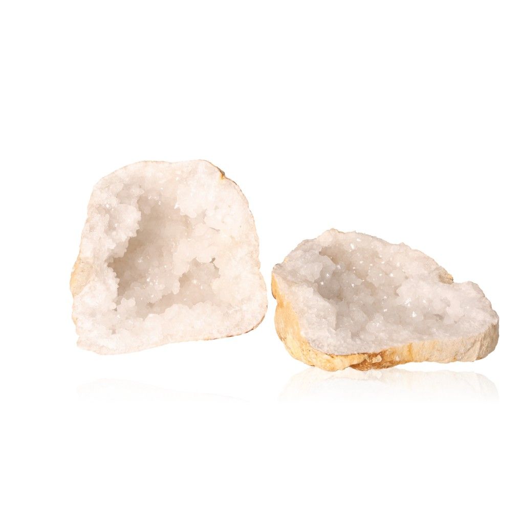 Milky quartz geode with earthy shell and sparkling white crystals, enhancing tranquility and clarity, perfect for energy balance.