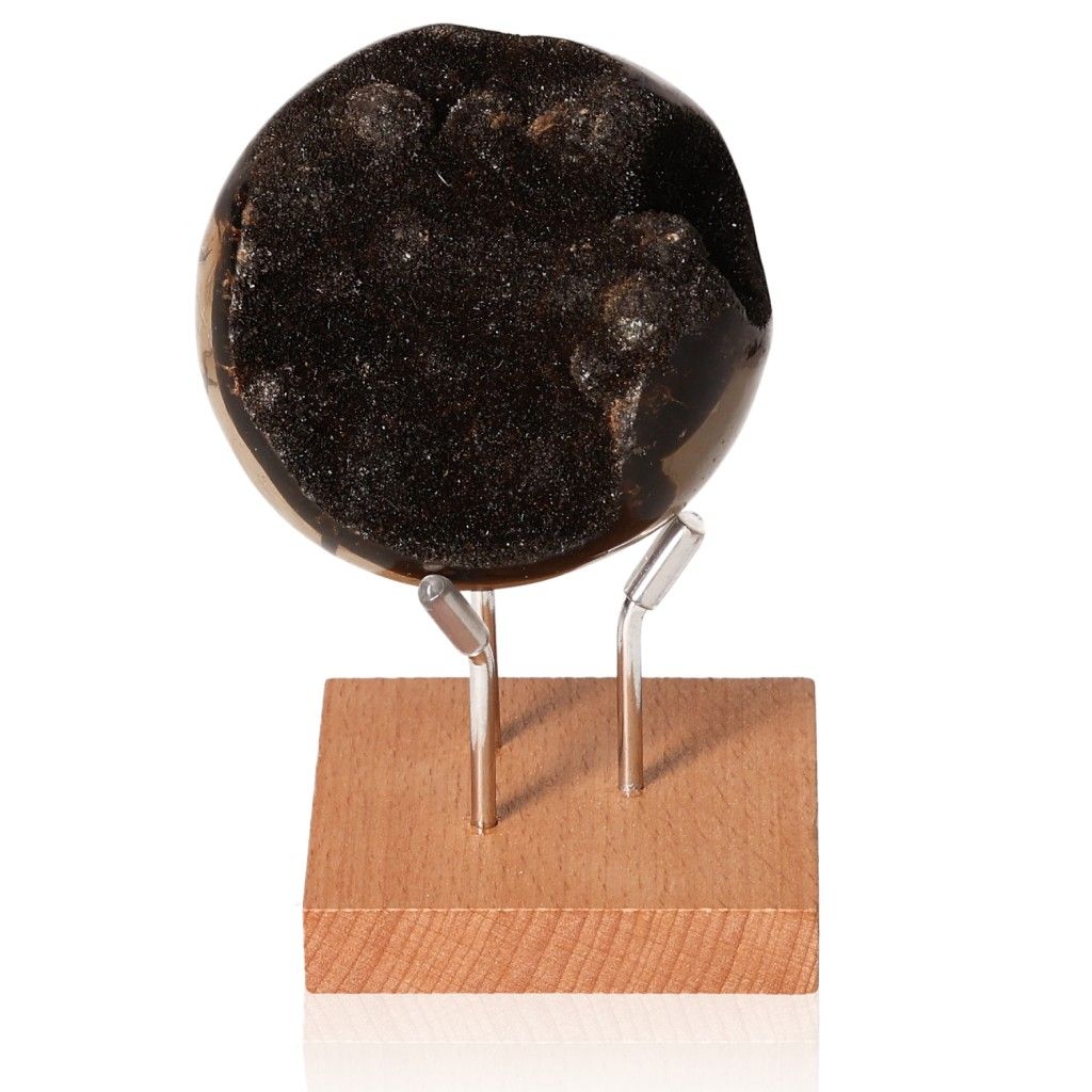 Septarian stone sphere on wooden stand, showcasing its unique texture and dark, captivating appearance.