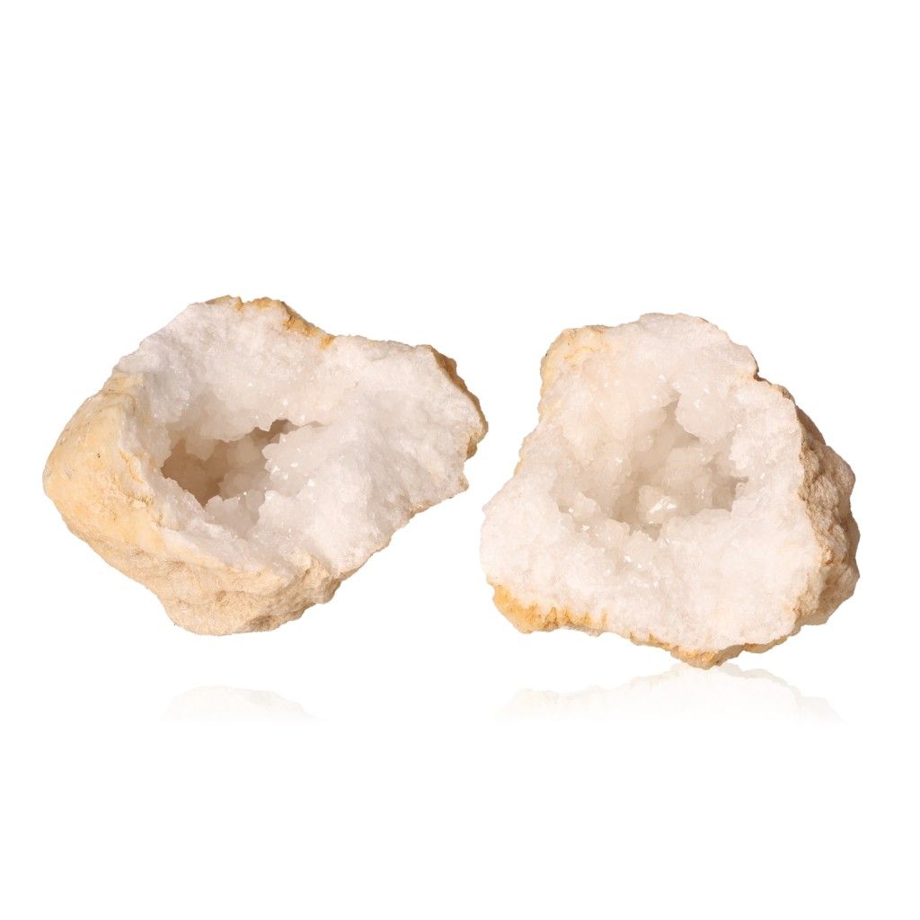 Sparkling milky quartz geode halves with rugged earthy shells, showcasing cloudy white crystals for energy cleansing and amplification.