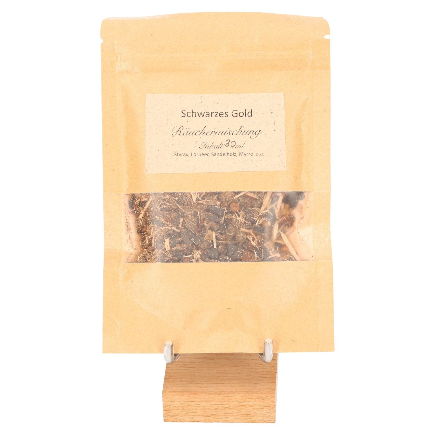 Black Gold incense blend in a kraft bag on a wooden stand, featuring relaxing and sensual aromatic ingredients.