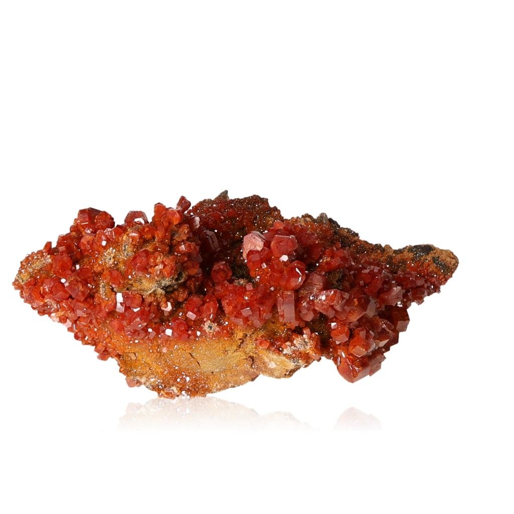 Vibrant Vanadinite Druze with hexagonal crystals in red-orange hues, enhancing focus and motivation through its bold geometric shapes.