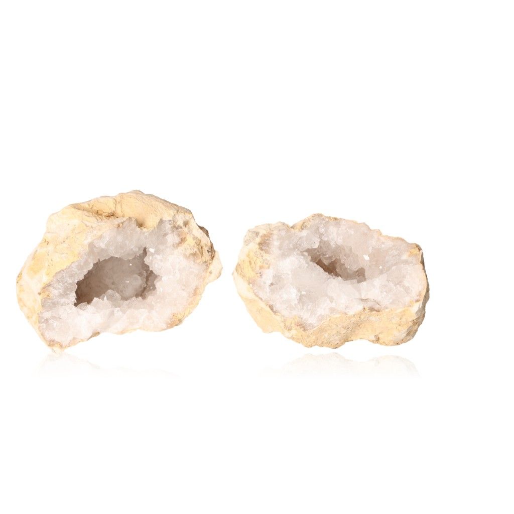 Milky quartz geodes with rugged shells and sparkling white crystals, known for purifying energy and enhancing tranquility.