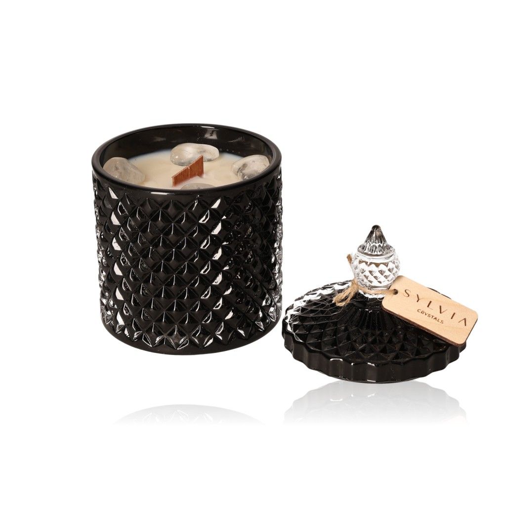 Elegant black soy candle in textured holder with lid, offering luxury and tranquility through Lavender & Almond scents.