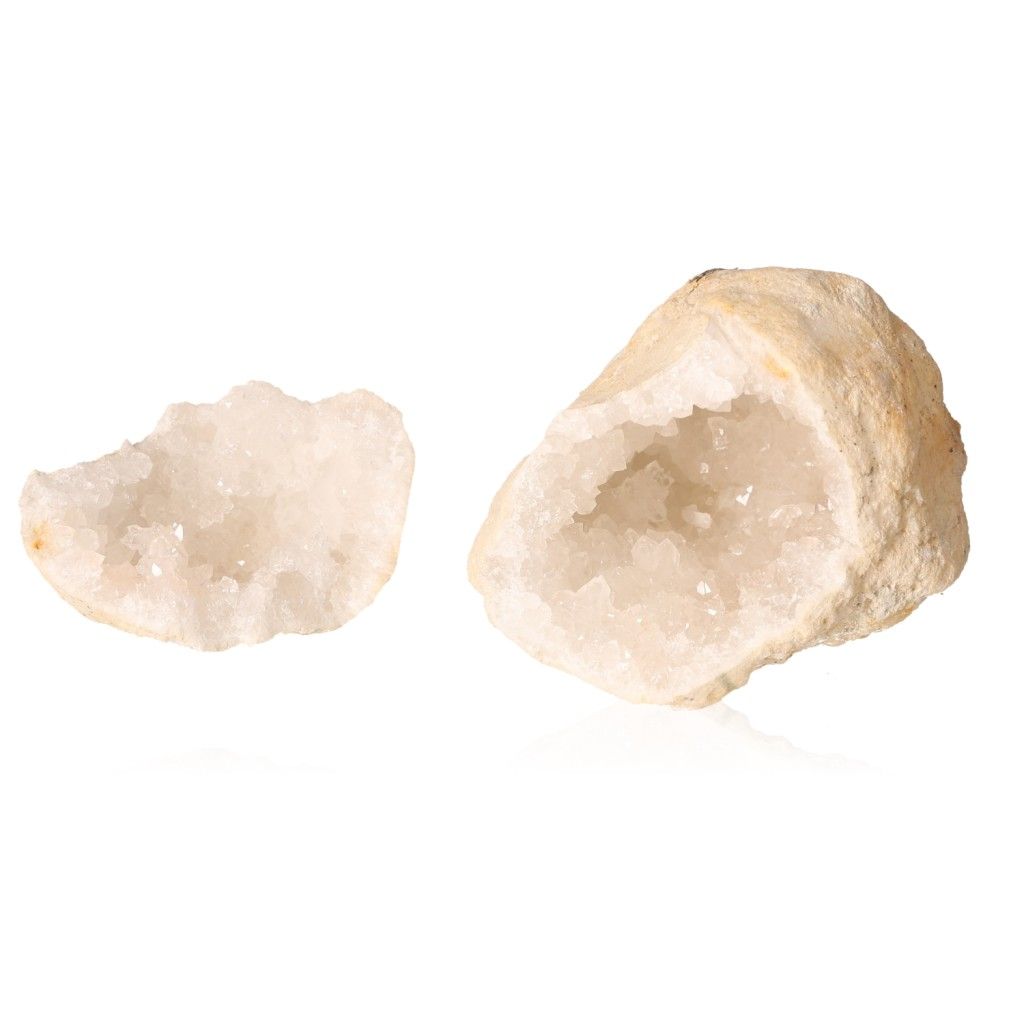 Milky quartz geode halves with sparkling white crystals, showcasing rugged exterior and tranquil inner beauty for energy balance.