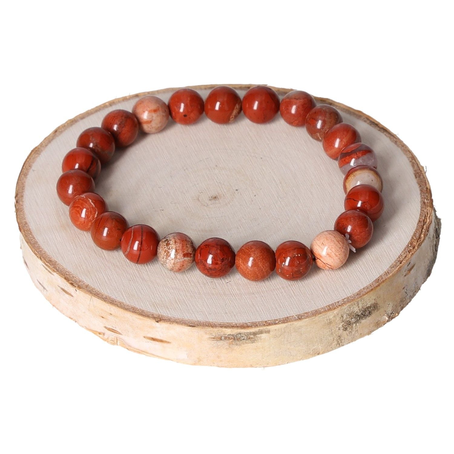 Jasper red bracelet with 8mm beads displayed on a wooden base.