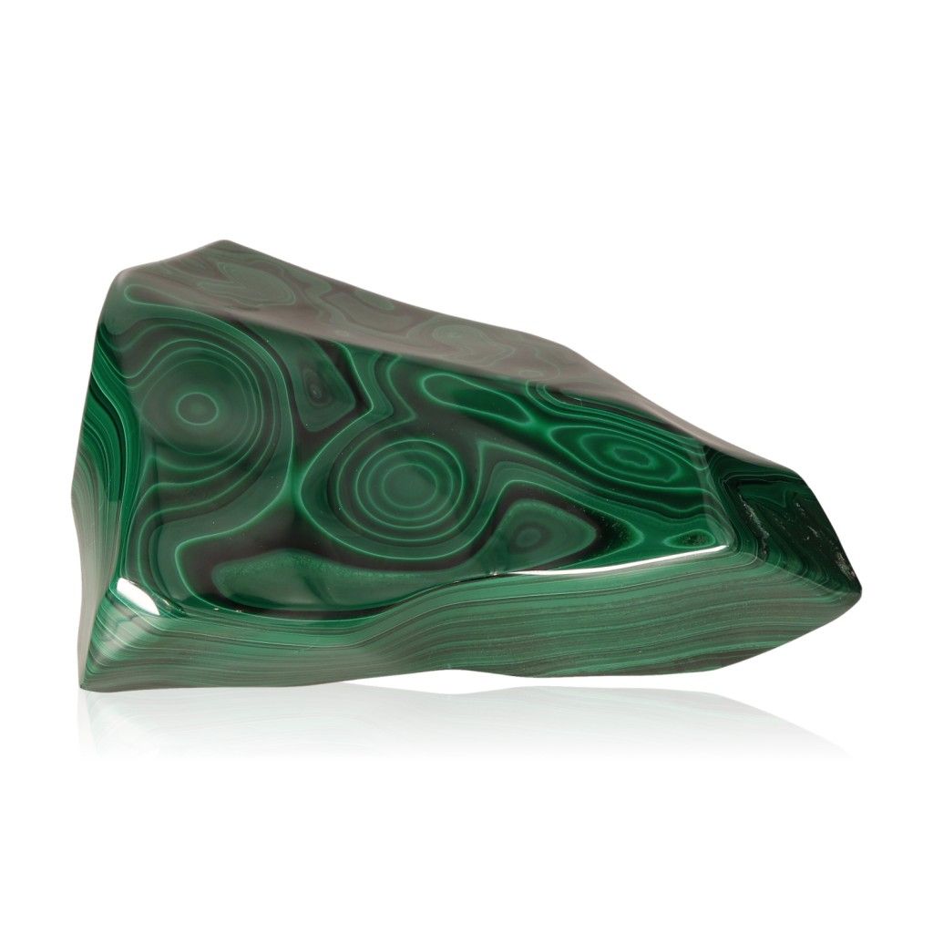 Polished green malachite gemstone with intricate patterns, known for its soothing energy and ability to inspire courage and optimism.