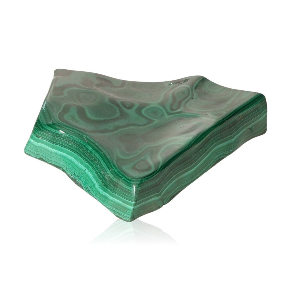 Polished green Malachite stone with soothing energy, symbolizing courage and harmony.