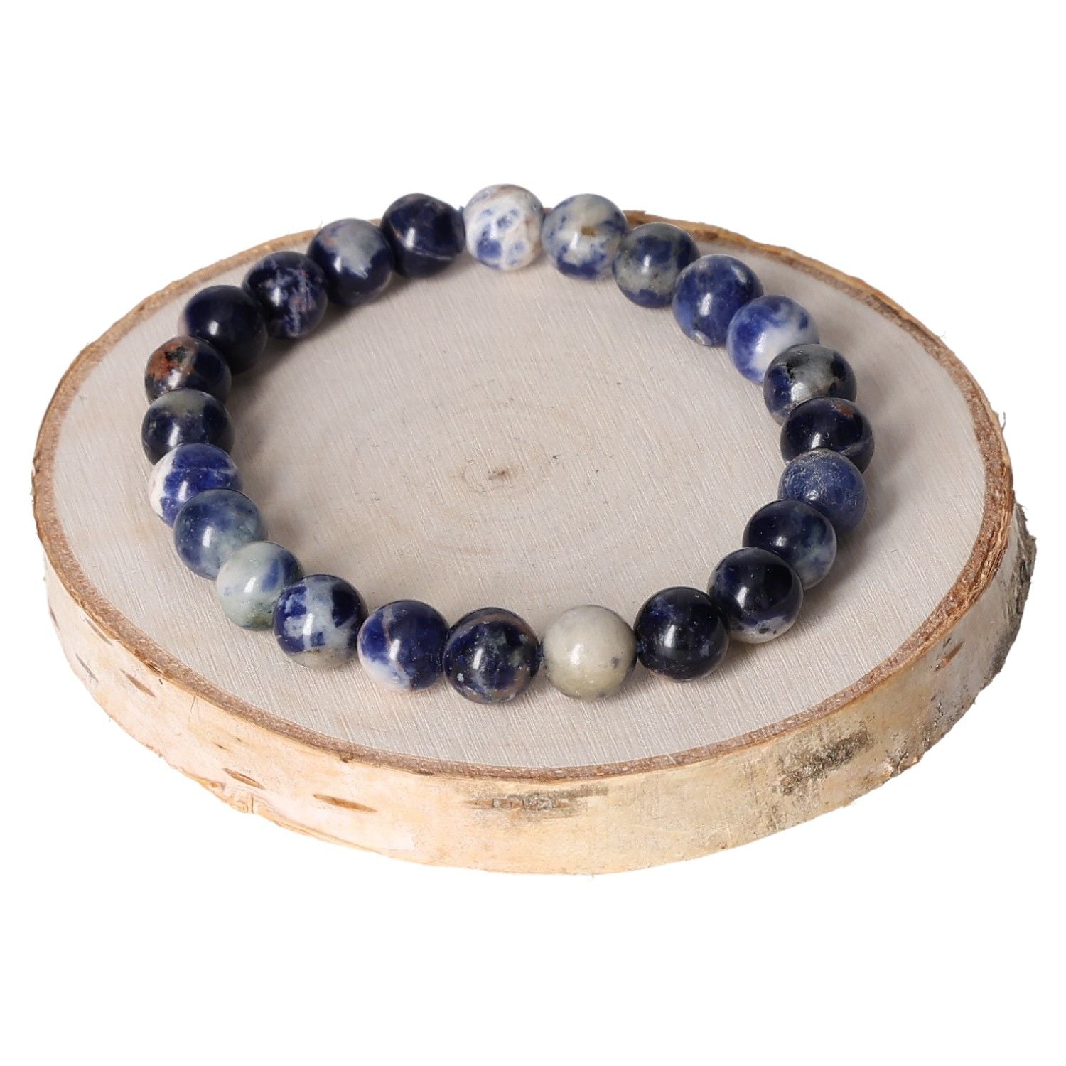 Sodalite bracelet with 8mm round beads on a wooden display.