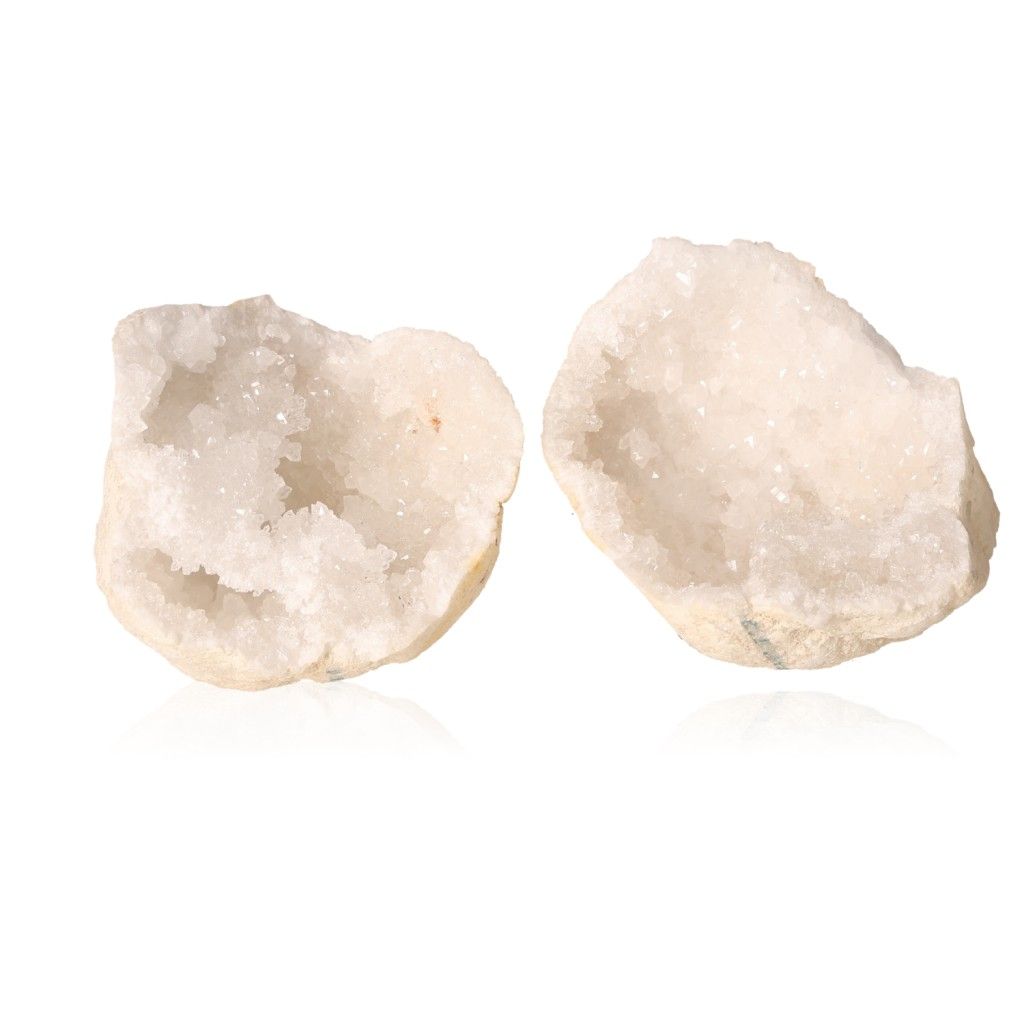 Milky quartz geode split open revealing sparkling white crystals, known for purifying energy and enhancing tranquility.