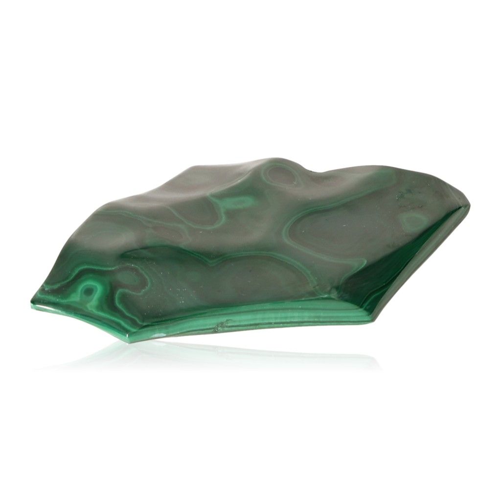 Malachite stone with soothing green hues and natural patterns, symbolizing courage and hope, placed on a white background.