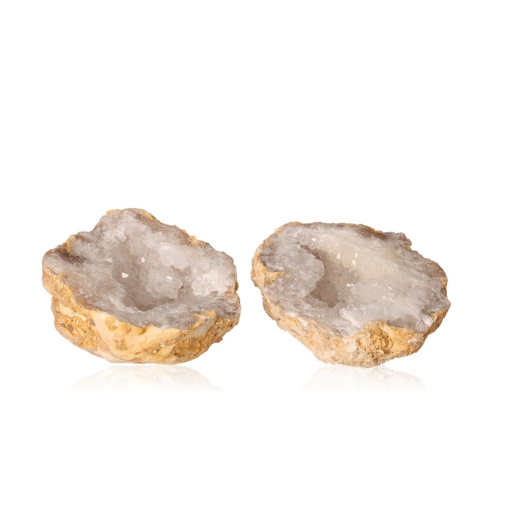 Milky quartz geode with open halves revealing sparkling white crystals, ideal for energy cleansing, balance, and promoting focus.