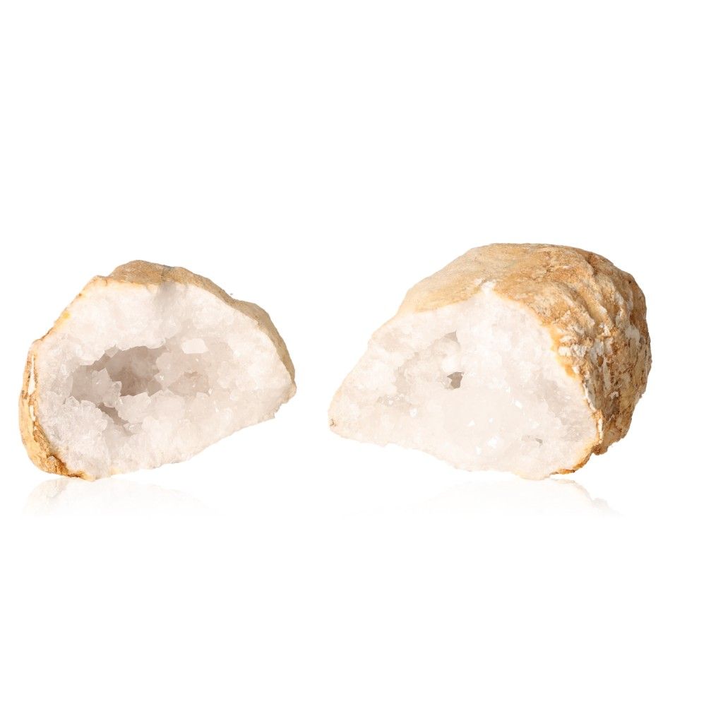 Milky quartz geode split open revealing sparkling white crystals, known for enhancing tranquility and cleansing energy.